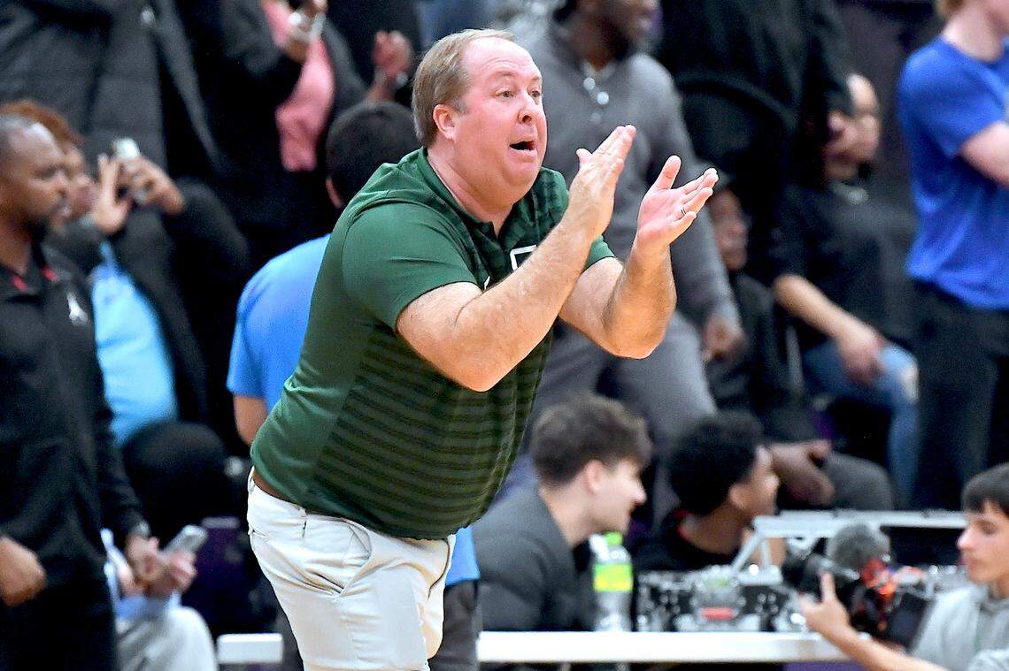 Greenfield head coach Rob Salter gives his team encouragement against Coronado in overtime. The Greenfield Knights and the Coronado Cougars (Nevada) met in the finals of the Day'Ron Sharpe bracket of the  John Wall Holiday Tournament in Raleigh, N.C. on December 30, 2025.