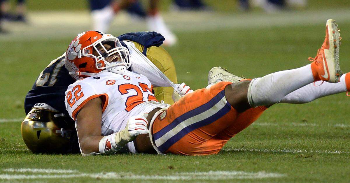 Clemson Tigers linebacker Trenton Simpson begins to celebrate his sack of Notre Dame quarterback Ian Book, left, during the the ACC Championship. Clemson defeated Notre Dame 34-10 to win the championship at Bank of America Stadium in Charlotte, NC on Saturday, December 19, 2020.  