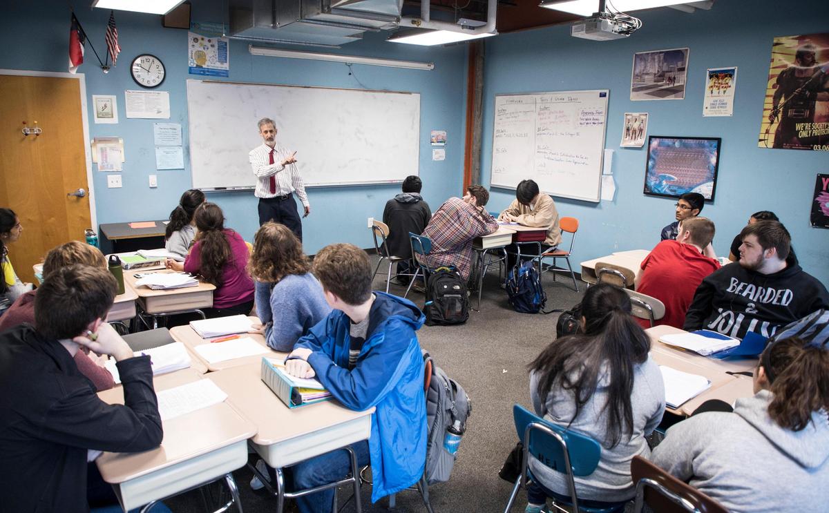 Kenny Felder, a math teacher at Raleigh Charter High School, explains repeating decimals to calculus students on Wednesday, Feb. 27, 2019.
