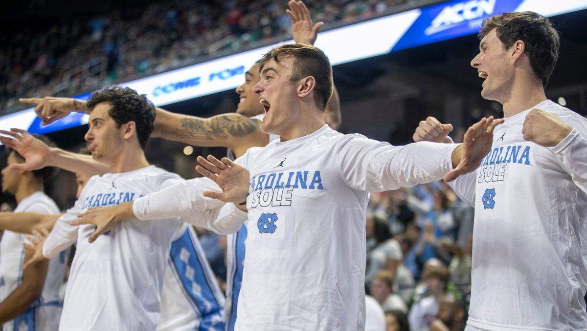 North Carolina’s Jackson Watkins (30) leads the celebration on the Tar Heels’ bench after a dunk Dontrez Styles (3) in the second half against Boston College during the second round of the ACC Tournament on Wednesday, March 8, 2023 at the Greensboro Coliseum in Greensboro, N.C.