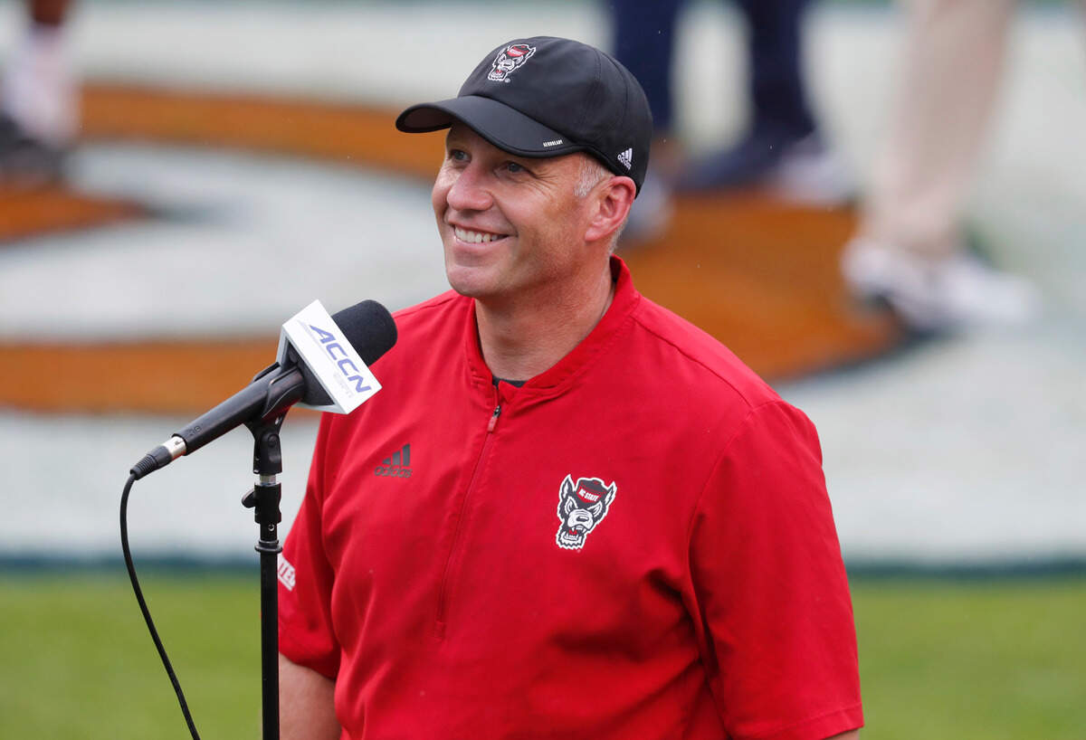 N.C. State head coach Dave Doeren smiles before being interviewed after N.C. State’s 38-21 victory over Virginia at Scott Stadium in Charlottesville, Va., Saturday, Oct. 10, 2020.