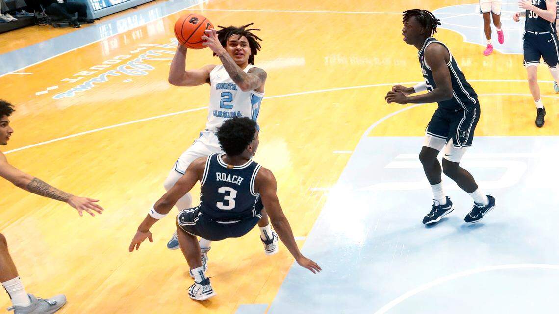 Duke’s Jeremy Roach (3) is called for the foul as he defends North Carolina’s Elliot Cadeau (2) in the first half during UNC’s 93-84 victory over Duke at the Smith Center in Chapel Hill, N.C., Saturday, Feb. 3, 2024.