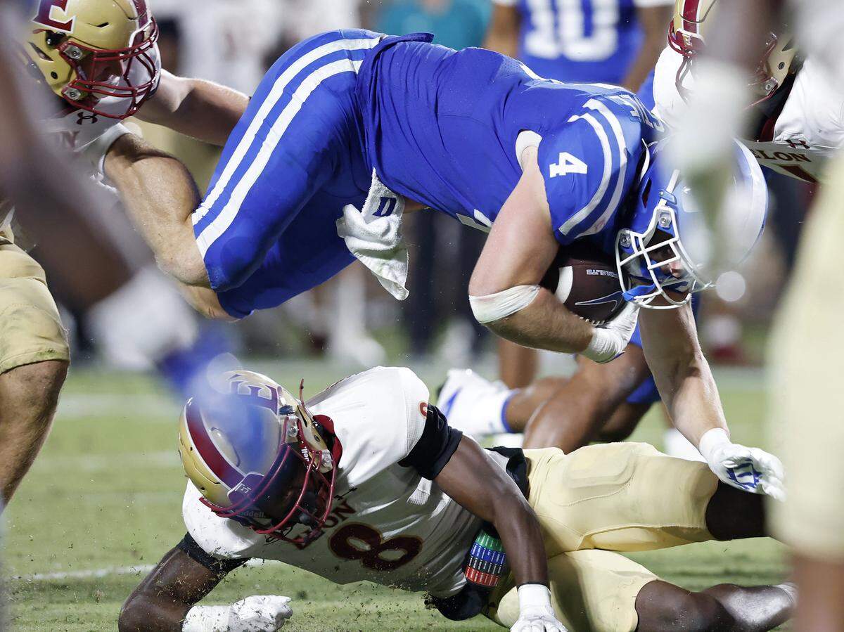Duke’s Anderson Castle jumps over Elon’s Darren James-Hamilton during the second half of the Blue Devils’ 45-17 win on Thursday, Aug. 28, 2025, at Wallace Wade Stadium in Durham, N.C.