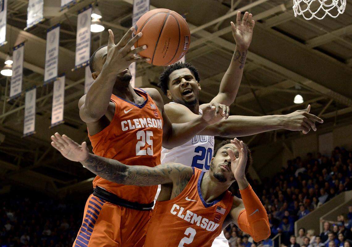 Duke center Marques Bolden (20) battles for a first half rebound against Clemson forward Aamir Simms (25) and guard Marcquise Reed (2) at Cameron Indoor Stadium In Durham, N.C. Saturday, Jan.5, 2019.