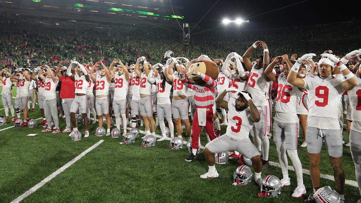 Sep 23, 2023; South Bend, Indiana, USA; Ohio State Buckeyes players sing Carmen Ohio after beating Notre Dame Fighting Irish 17-14 at Notre Dame Stadium.