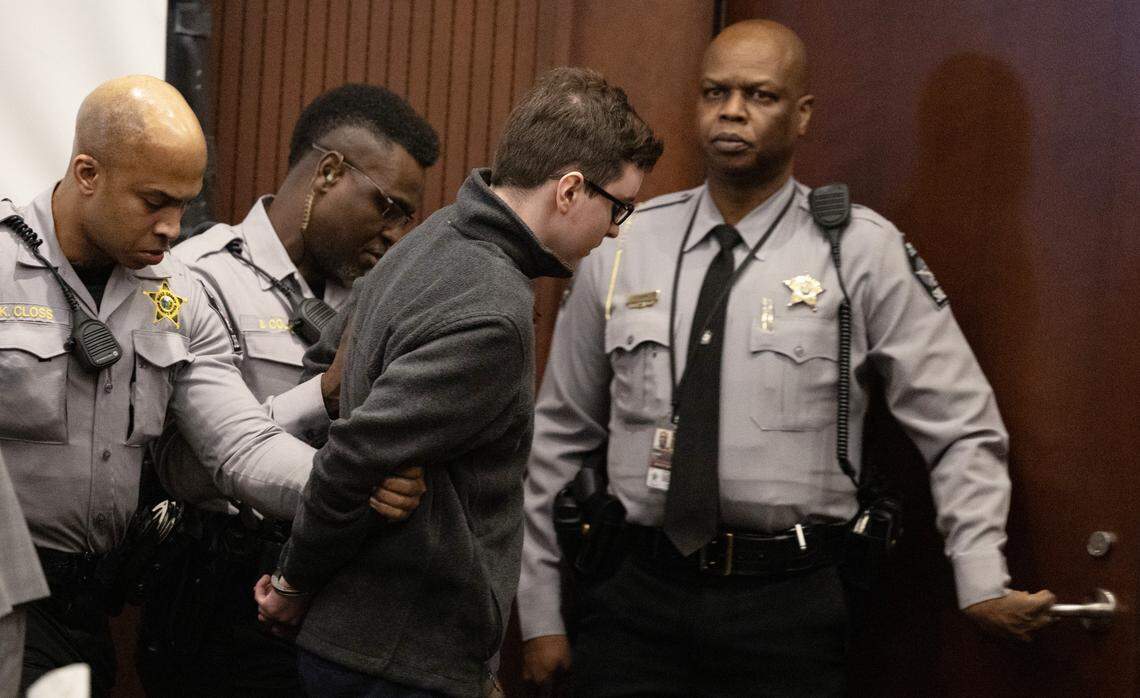 Deputies lead a handcuffed Austin Thompson from the courtroom after the teenager was sentenced to five life sentences without the possibility of parole.