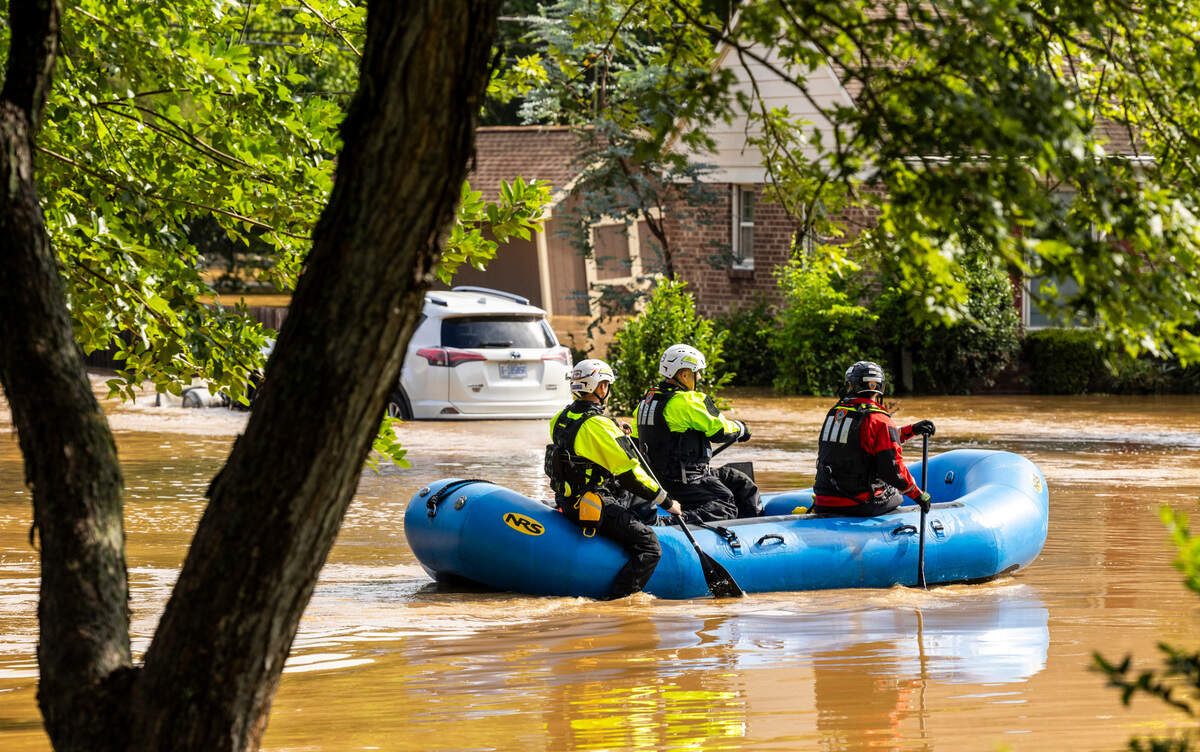 A water rescue unit paddles a raft in the Old Farm neighborhood along the Eno River in Durham on Monday morning, July 7, 2025, after Tropical Storm Chantal caused flash flooding.