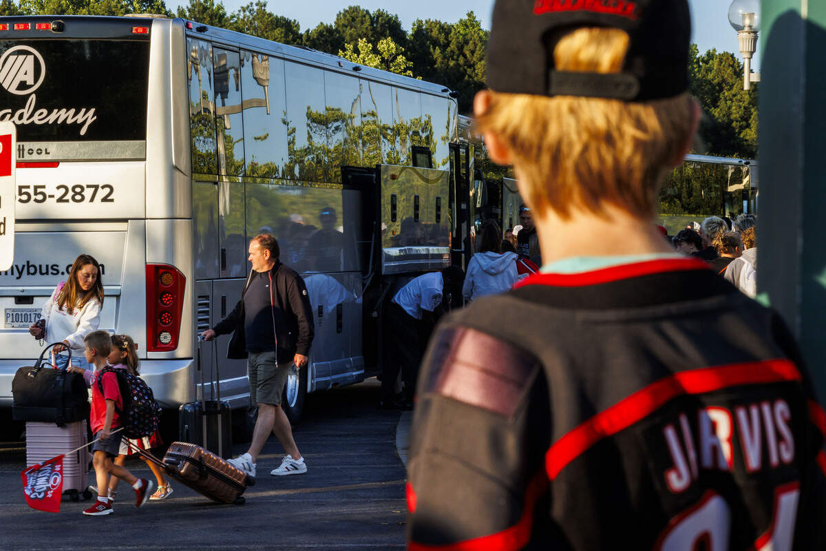 Fans waited in the parking lot to greet the families of Carolina Hurricanes players outside Lenovo Center on June 15, 2026, in Raleigh, North Carolina, as they arrived back home following the Stanley Cup finals game 6, which took place in Las Vegas.