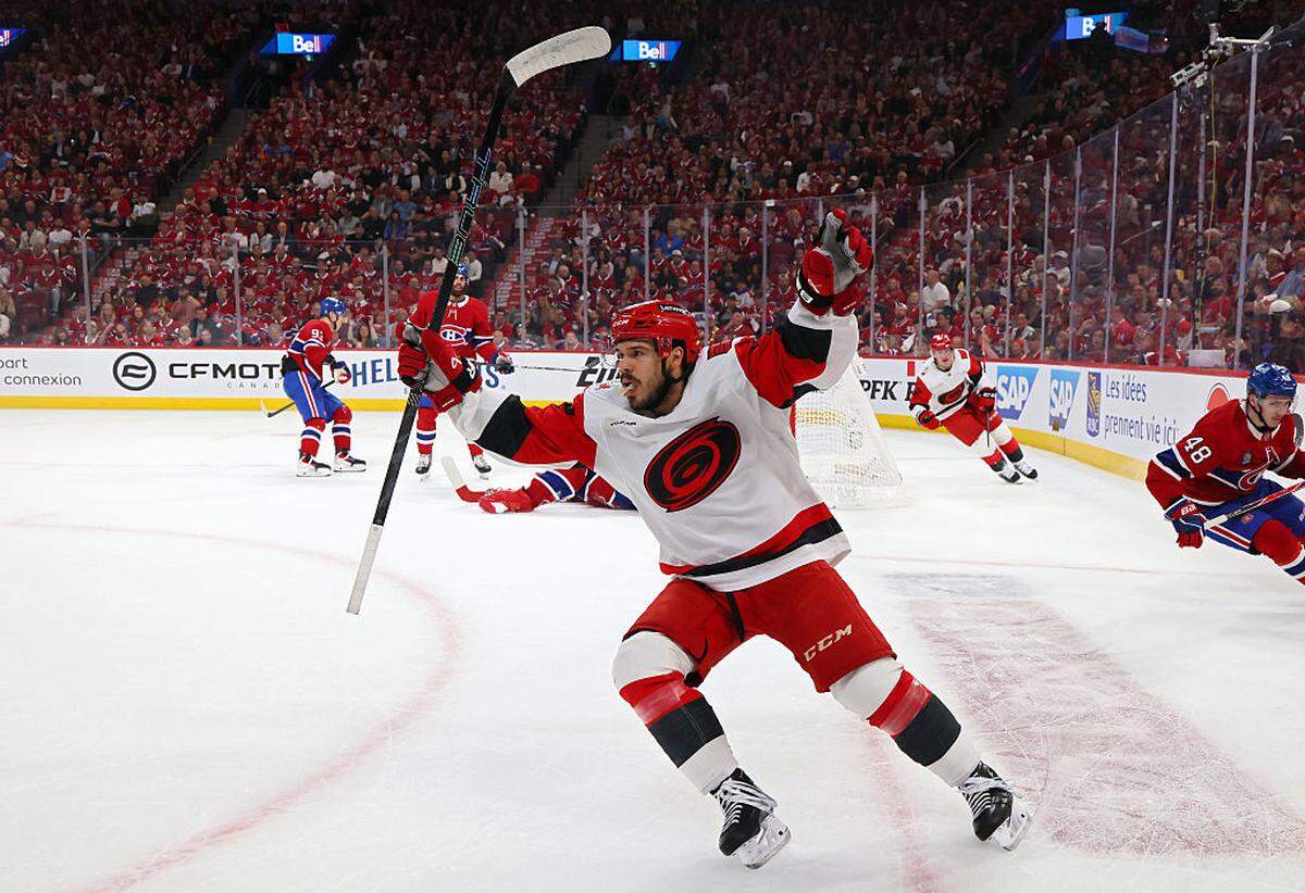 Logan Stankoven (22) of the Carolina Hurricanes celebrates after scoring a goal against the Montreal Canadiens during the first period in Game Four of the Eastern Conference Final of the 2026 Stanley Cup Playoffs at Bell Centre on May 27, 2026 in Montreal, Quebec.