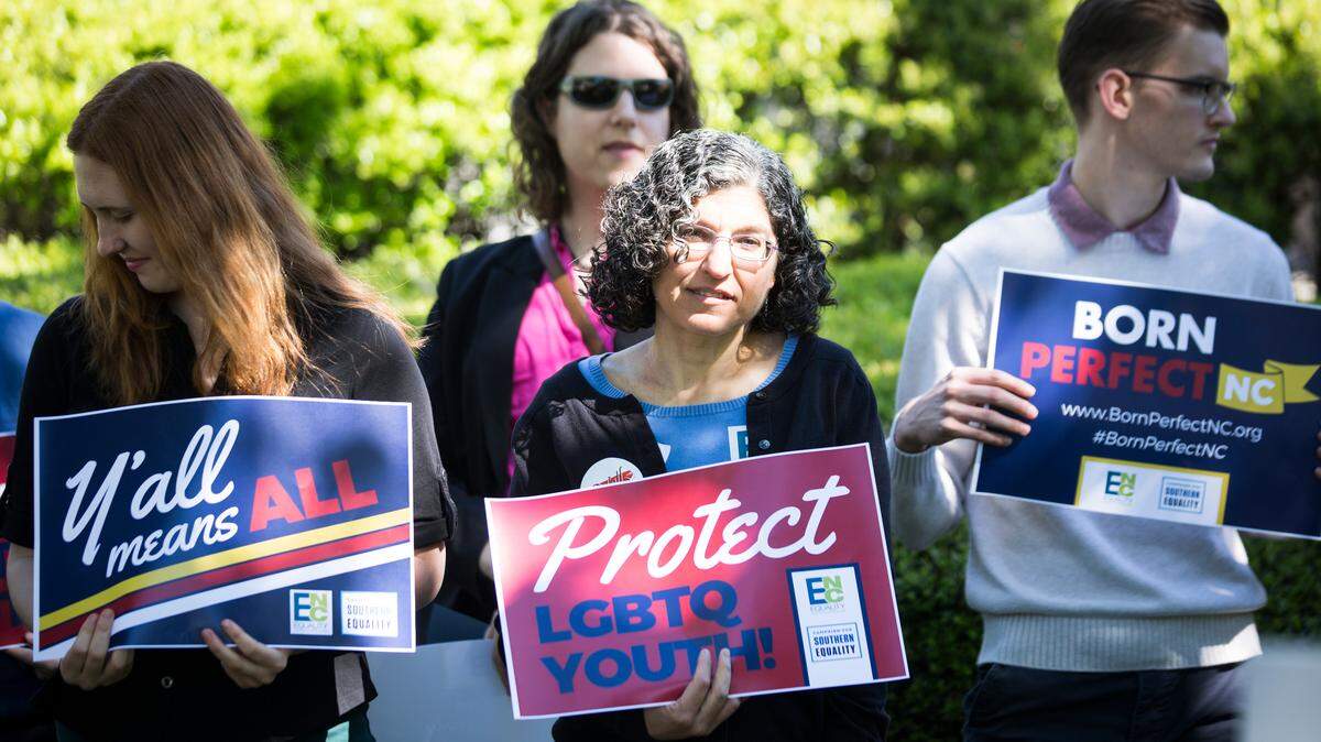 Supporters of three new bills meant to expand protections for LGBTQ+ citizens stand outside the N.C. General Assembly for a press conference on Tuesday, April 16, 2019.