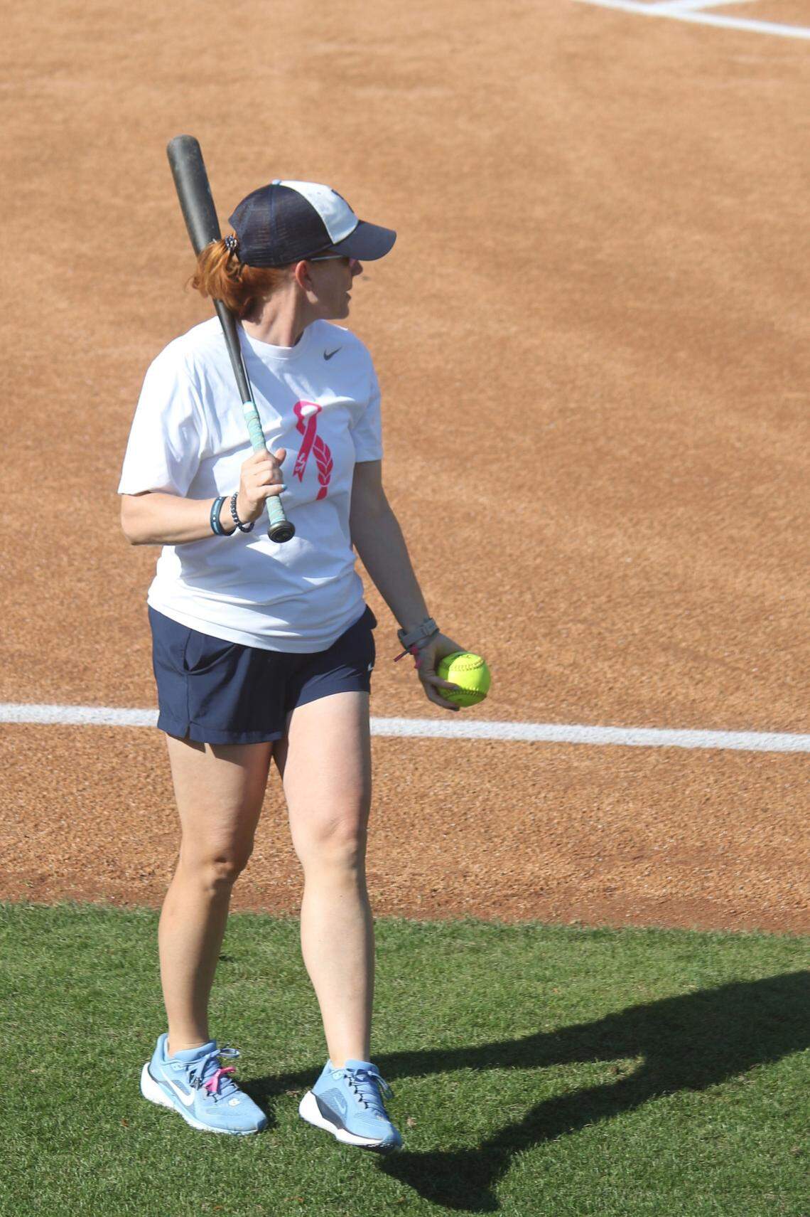 UNC head coach Megan Smith Lyon prepares to hit during warmups for the Tar Heels’ game against N.C. State on April 18, 2025, at Anderson Stadium in Chapel Hill, North Carolina.