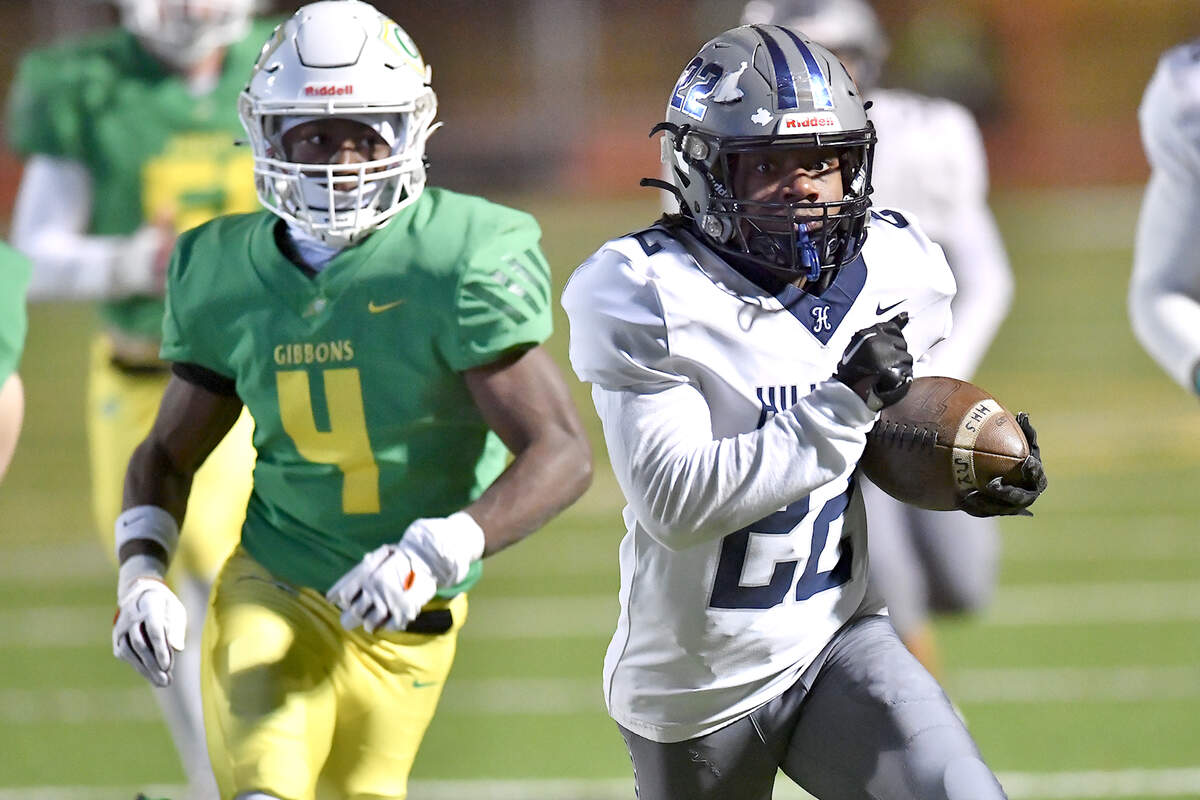 Hillside running back Christian Cook (22) runs for the touchdown ahead of Braylon Peebles (4) during the second half. The Cardinal Gibbons Crusaders and the Durham Hillside Hornets met in the third round of the NCHSAA 4A playoffs in Raleigh, N.C. on November 29, 2024.