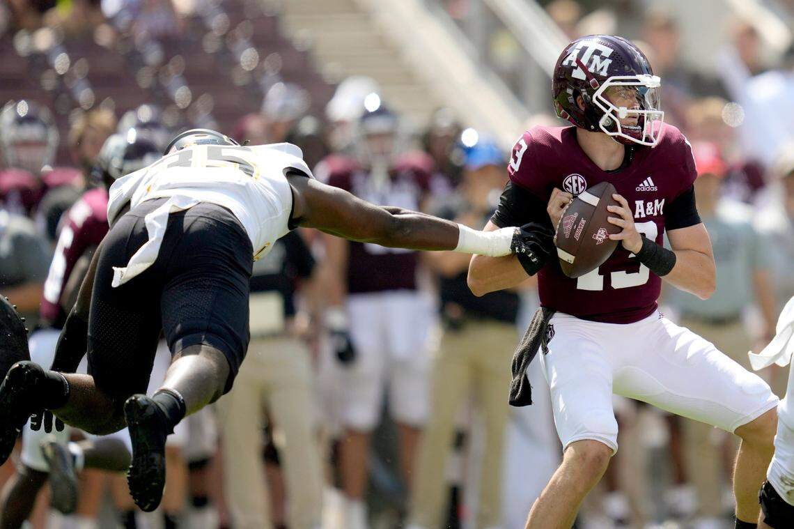 Appalachian State linebacker Jalen McLeod (35) knocks the ball away from Texas A&M quarterback Haynes King (13) to cause a turnover during the first quarter of an NCAA college football game Saturday, Sept. 10, 2022, in College Station, Texas.