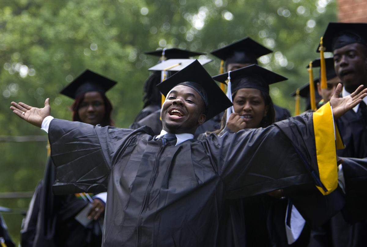 St. Augustine's College senior Lawrence Pinckney shouts out to one of his friends before the start of his graduation ceremony on campus on Saturday, May 9, 2009. 