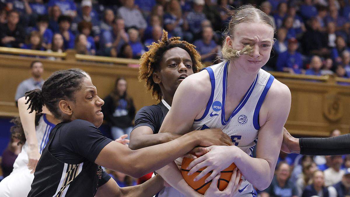 Duke’s Toby Fournier muscles a rebound away from College of Charleston’s Taryn Barbot and Taylor Barbot during the second half of the Blue Devils’ 81-64 first-round NCAA Tournament win on Friday, March 20, 2026, at Cameron Indoor Stadium in Durham, N.C.