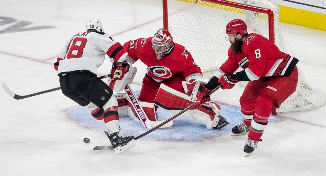 The Carolina Hurricanes Brent Burns (8) stops a scoring attempt on goalie Carolina Hurricanes goalie Frederik Andersen (31) by the New Jersey Devils Ondrej Palat (18) in the third period during Game 5 of their second round Stanley Cup playoff series on Thursday, May 11, 2023 at PNC Arena in Raleigh, N.C.