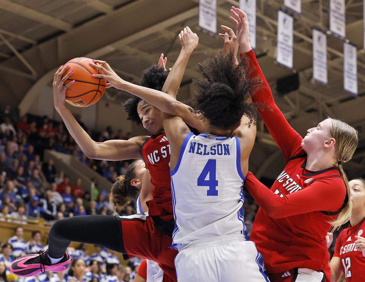 N.C. State’s Qadence Samuels pulls down a rebound over Duke’s Riley Nelson during the second half of the Wolfpack’s 83-65 loss on Thursday, Feb. 19, 2026, at Cameron Indoor Stadium in Durham, N.C.