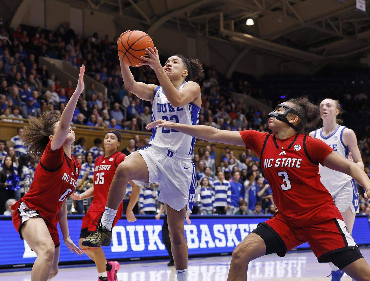 Duke’s Taina Mair drives past N.C. State’s Devyn Quigley and Zamareya Jones during the second half of the Blue Devils’ 83-65 win on Thursday, Feb. 19, 2026, at Cameron Indoor Stadium in Durham, N.C.