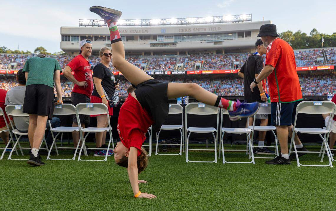 Ten-year-old Peyton Ellis of State College Pa. Does cartwheels as she waits for the start of the FC Series game between Chelsea and Wrexham on Wednesday, July 19, in Chapel Hill, N.C.