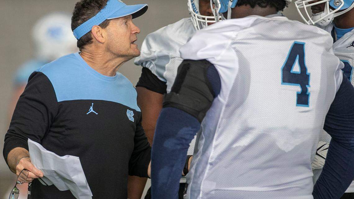 North Carolina assistant head coach for defense, Gene Chizik, works with defensive linemen during the opening day of the Tar Heels’ spring football practice on Tuesday, March 1, 2022 in Chapel Hill, N.C.