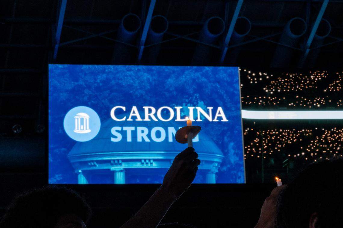 UNC-Chapel Hill students, faculty and family hold a candlelight vigil Friday, Aug 30, 2023 at the Dean Smith Center in honor of professor Zijie Yan who was shot and killed on campus on Monday.