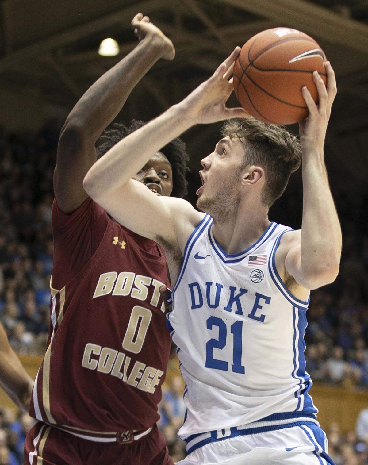 Duke’s Matthew Hurt (21) drives to the basket against Boston College’s C.J. Felder (0) during the first half on Tuesday, December 31, 2019 at Cameron Indoor Stadium in Durham, N.C. Hurt scored 20 points in the first half and lead all scores with 25 points.