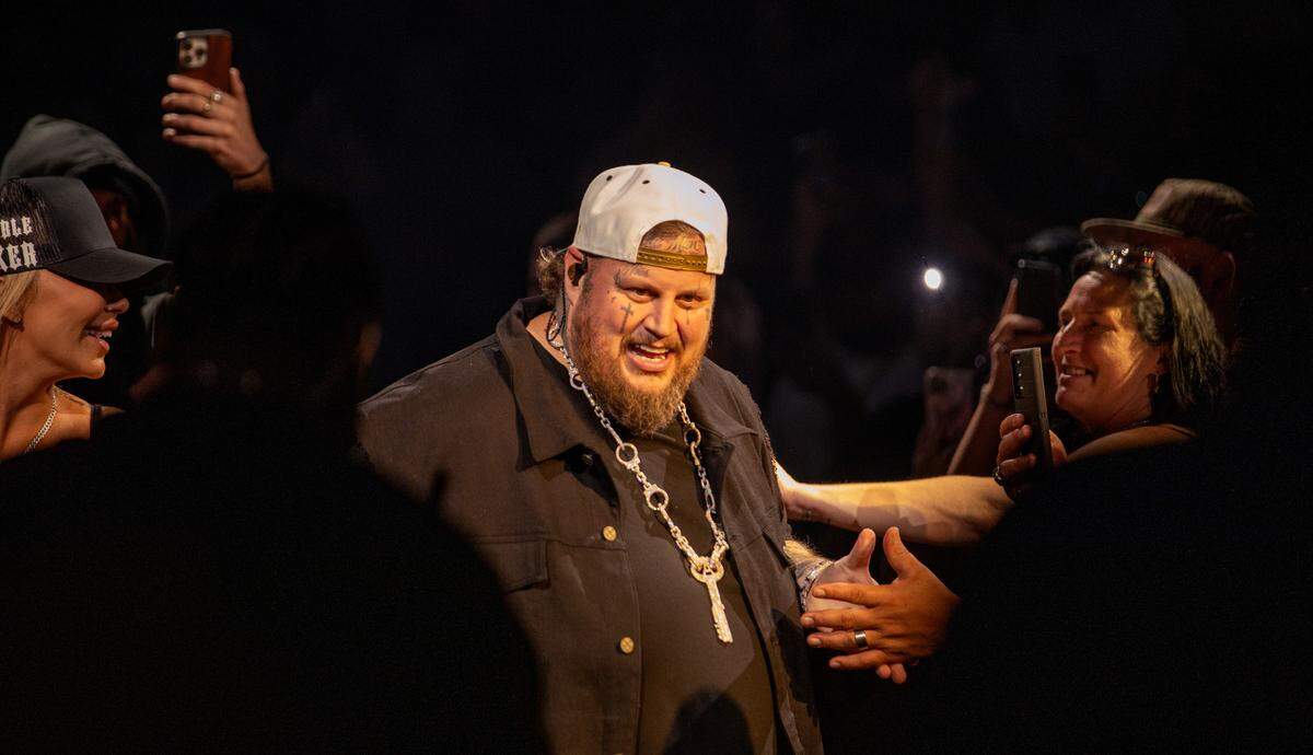 Jelly Roll makes his way through the crowd before taking the stage brings at Raleigh, N.C.’s Lenovo Center, Friday night, Sept. 20, 2024.