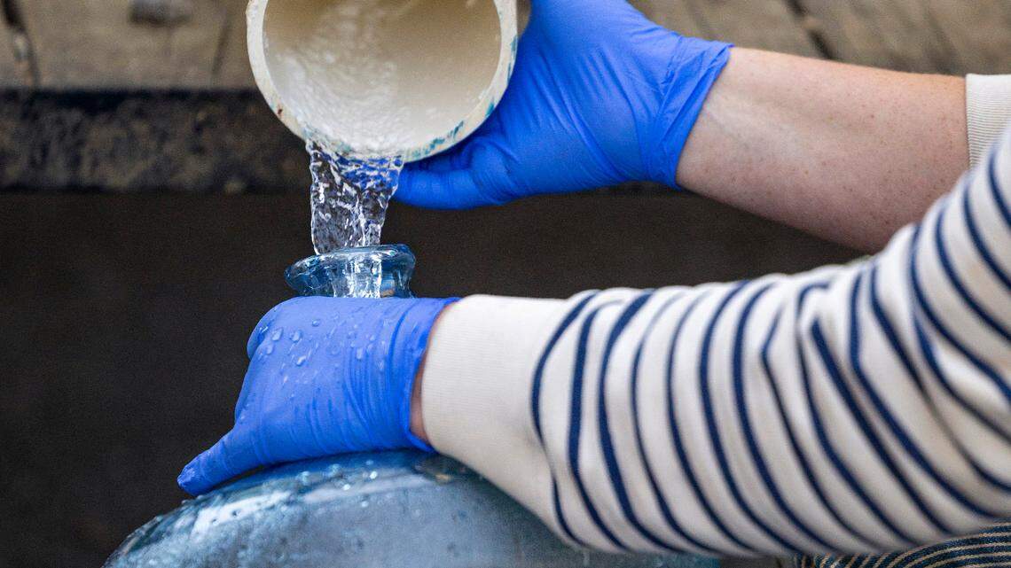 Volunteers with BeLoved Asheville filled bottles of drinking water for residents in low-income independent living facilities on Oct. 8. After so many weeks without Asheville has its drinking water back.