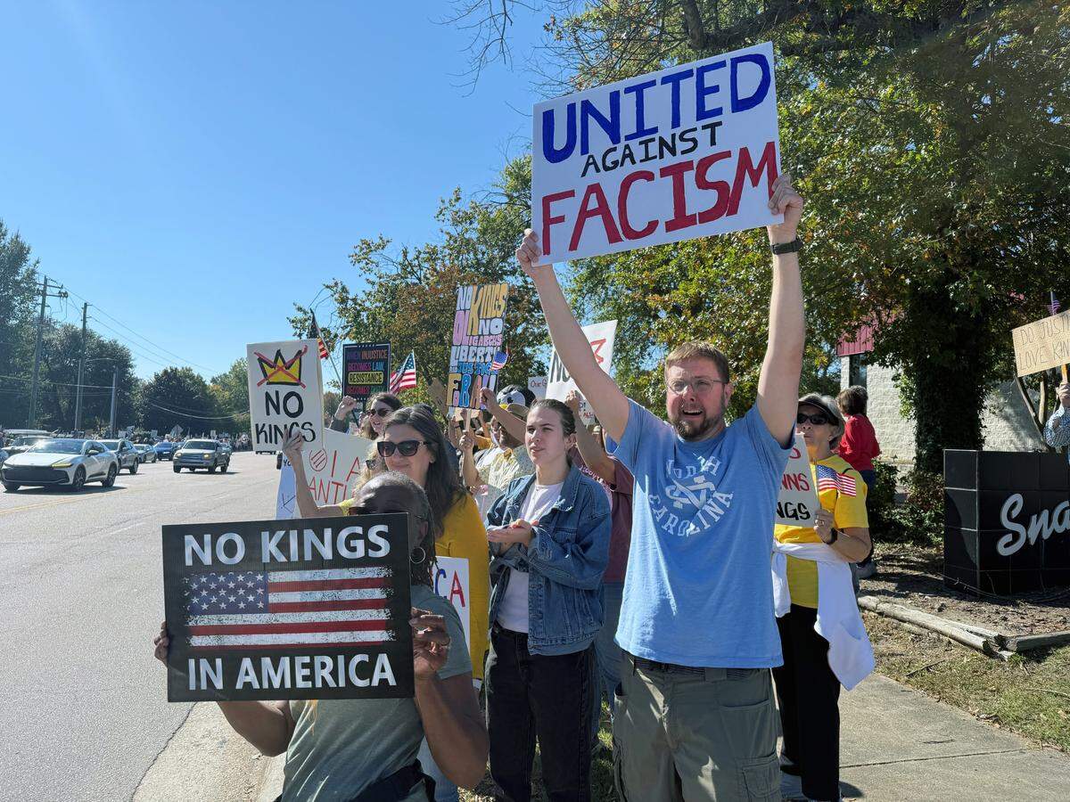 No Kings protesters line Cary Parkway Saturday, October 18, 2025.