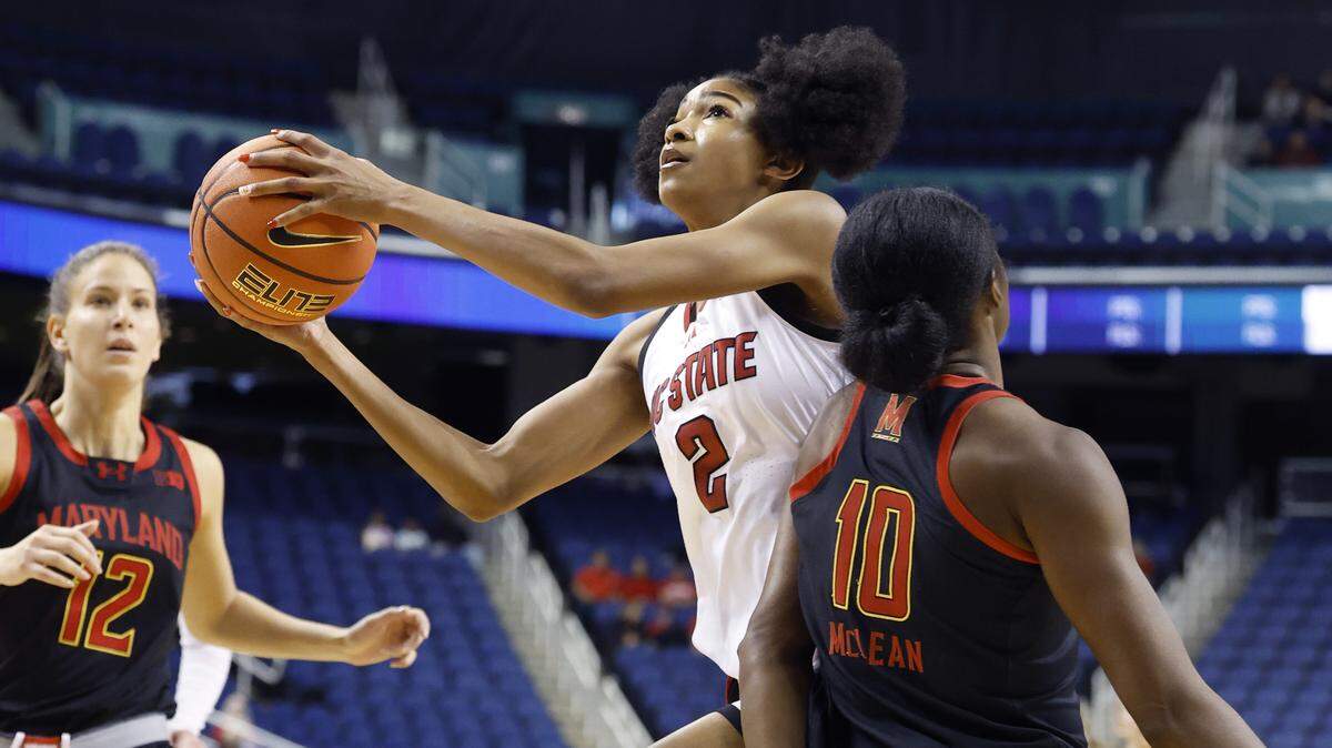 N.C. State's Qadence Samuels (2) drives past Maryland's Mir McLean (10) during the first half of N.C. StateÕs exhibition game against Maryland at the First Horizon Coliseum in Greensboro, N.C., Sunday Oct. 26, 2025.