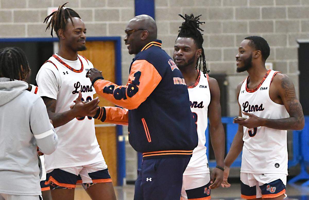 Lincoln University head basketball coach Julius Hodge greets players during the Lion’s Madness event at the school this month.