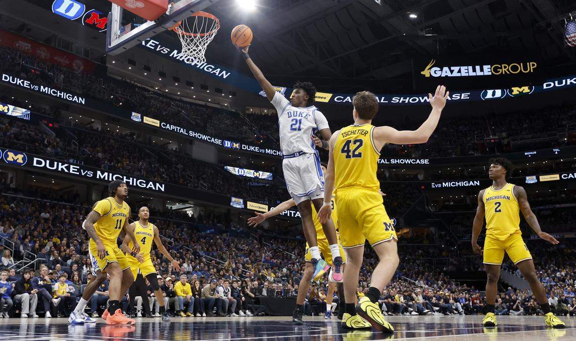 Duke’s Patrick Ngongba II (21) heads to the basket during Duke’s 68-63 victory over Michigan in the Capital Showcase at Capital One Arena in Washington, D.C., Saturday, Feb. 21, 2026.