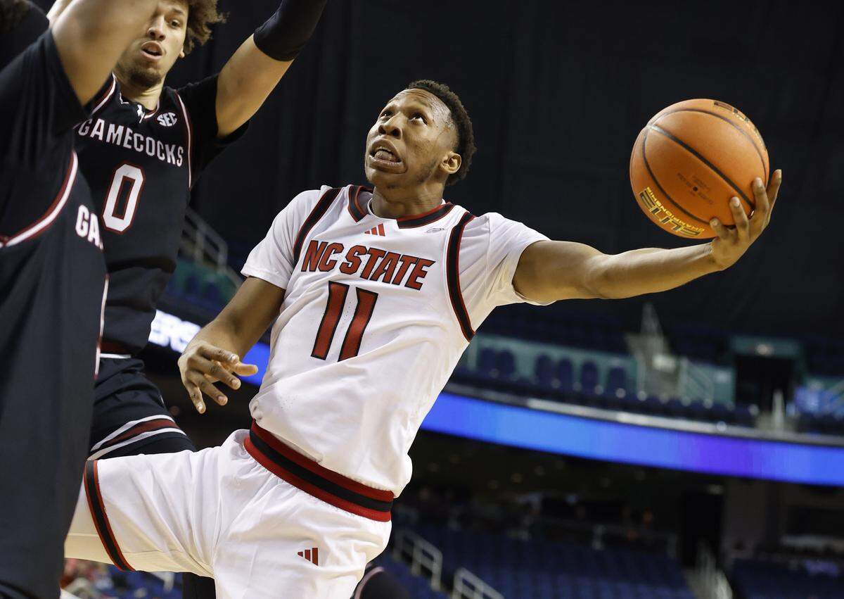 N.C. State's Quadir Copeland (11) shoots during the first half of  N.C. State’s exhibition game against South Carolina at the First Horizon Coliseum in Greensboro, N.C., Sunday Oct. 26, 2025.