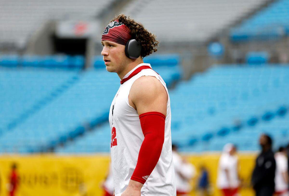 N.C. State linebacker Drake Thomas (32) warms up before the Wolfpack’s game against Maryland in the Duke’s Mayo Bowl at Bank of America Stadium in Charlotte on Dec. 30, 2022.