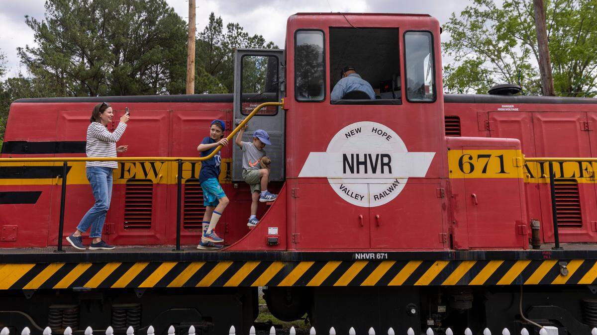 Passengers prepare to tour a locomotive at New Hope Valley Railway in Bonsal on April 12, 2024. The nonprofit railway is a program of the N.C. Railway Museum, which has several rail cars and engines on display in southwest Wake County.