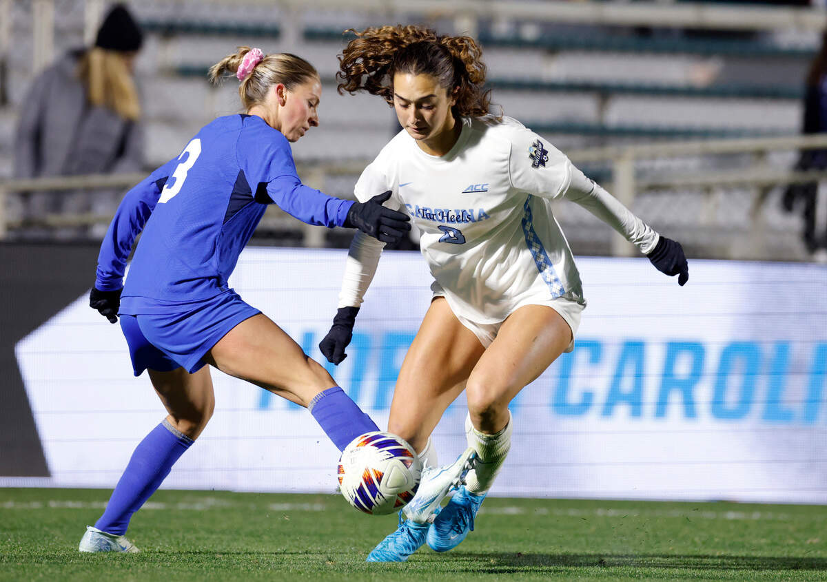 North Carolina’s Bella Gaetino (8) gets past Duke’s Ella Hase (3) during the second half of UNC’s 3-0 victory over Duke in the semifinals of the 2024 Women’s College Cup at WakeMed Soccer Park in Cary, N.C., Friday, Dec. 6, 2024.