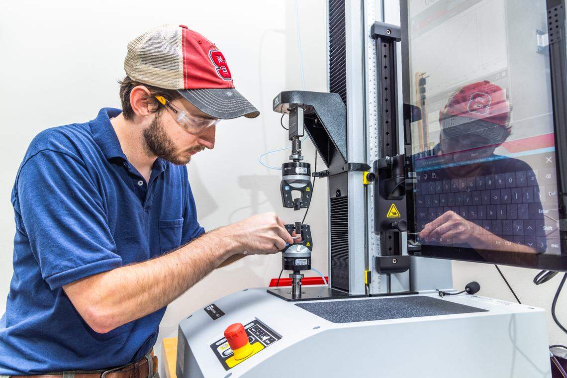 Mike Keating, a research specialist for the Nonwoven Institute at North Carolina State University, works on fabric research and development through the school’s partnership with Under Armour.