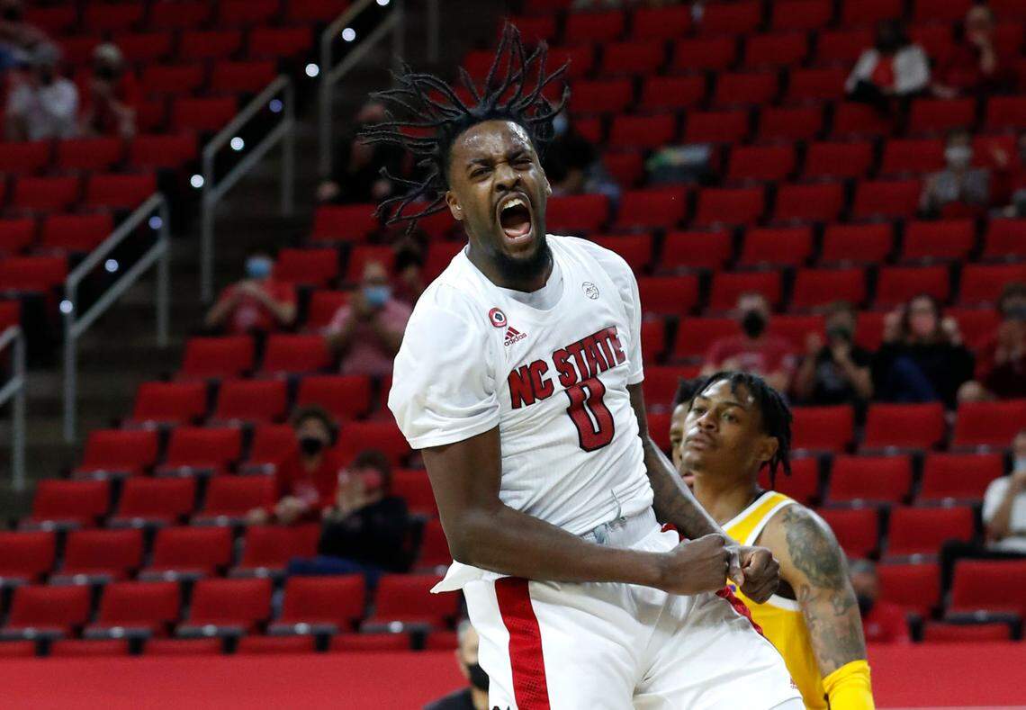 N.C. State’s D.J. Funderburk (0) celebrates after slamming in two during the second half of N.C. State’s 65-62 victory over Pittsburgh at PNC Arena in Raleigh, N.C., Sunday, February 28, 2021.