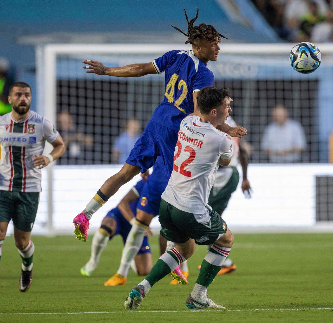 Chelsea’s Diego Moreira Jr. (42) battles with Wrexham’s Tom O’Connor (22) in the first half during their FC Series game on Wednesday, July 19, 2023 at Kenan Stadium in Chapel Hill, N.C.