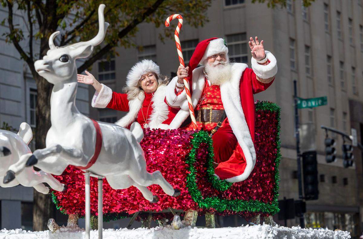 Santa Claus makes his way down Fayetteville Street during the 80th annual Raleigh Christmas Parade on Saturday, November 23, 2024 in Raleigh, N.C.
