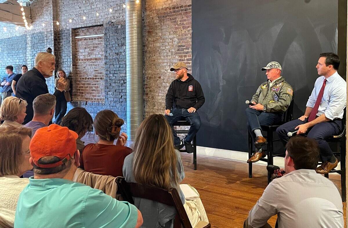 The crowd tried to shout down a man questioning Arizona Sen. Mark Kelly, a Democrat, about the “deep state media conspiracy” that Russia wanted Trump to be elected in 2016. Kelly acknowledged foreign interference in elections is “a challenging situation for us.”