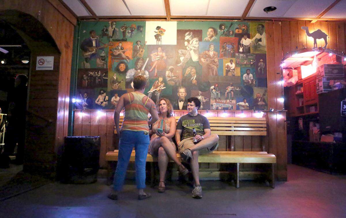 Amber Inscoe, of Wilson, and Jamie Proctor, of Raleigh, sit and have a drink before watching Southern Culture on the Skids at Berkeley Cafe in 2013.
