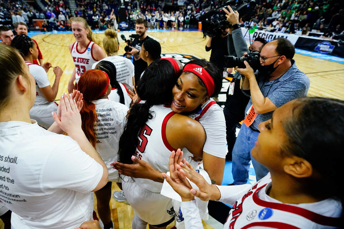 North Carolina State players celebrate after defeating Notre Dame in a college basketball game during the Sweet Sixteen round of the NCAA women’s tournament, Saturday, March 26, 2022, in Bridgeport, Conn. (AP Photo/Frank Franklin II)