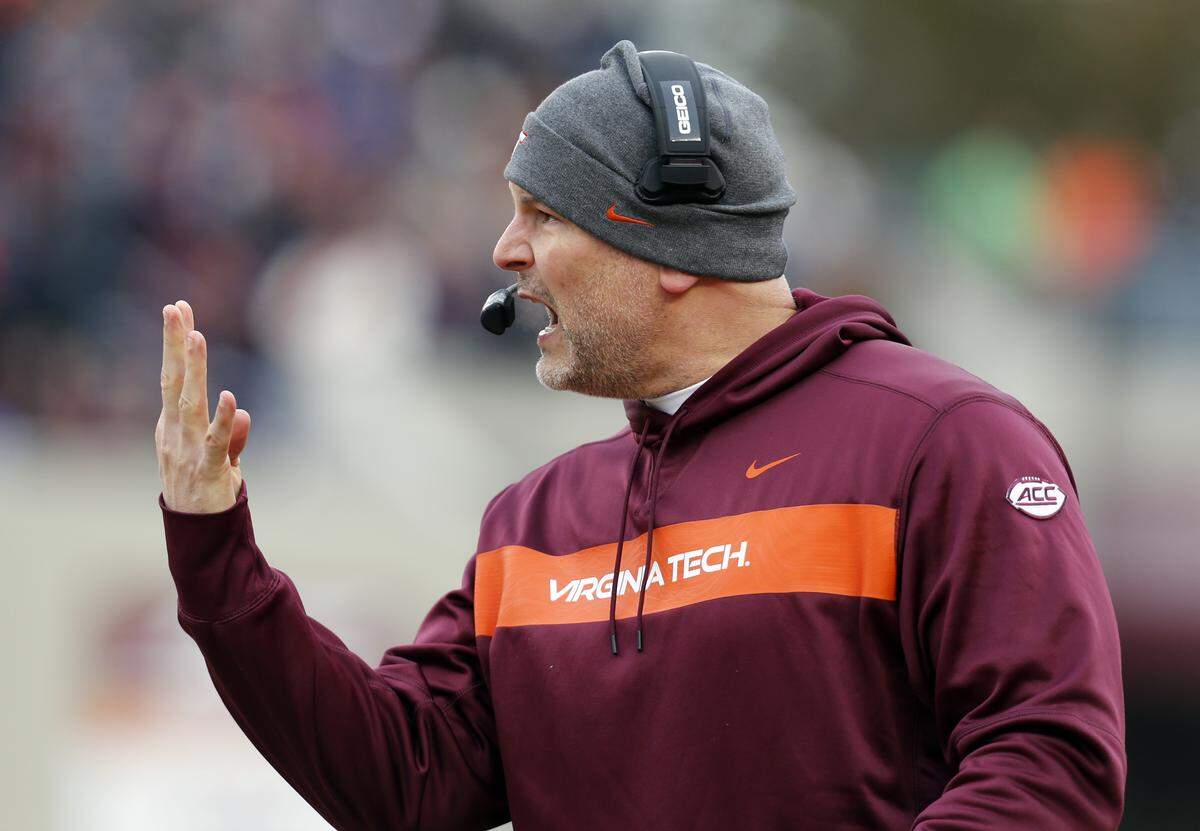 Virginia Tech head coach Justin Funente directs his team during the first half of an NCAA college football game in Blacksburg, Va., Friday, Nov. 23, 2018.