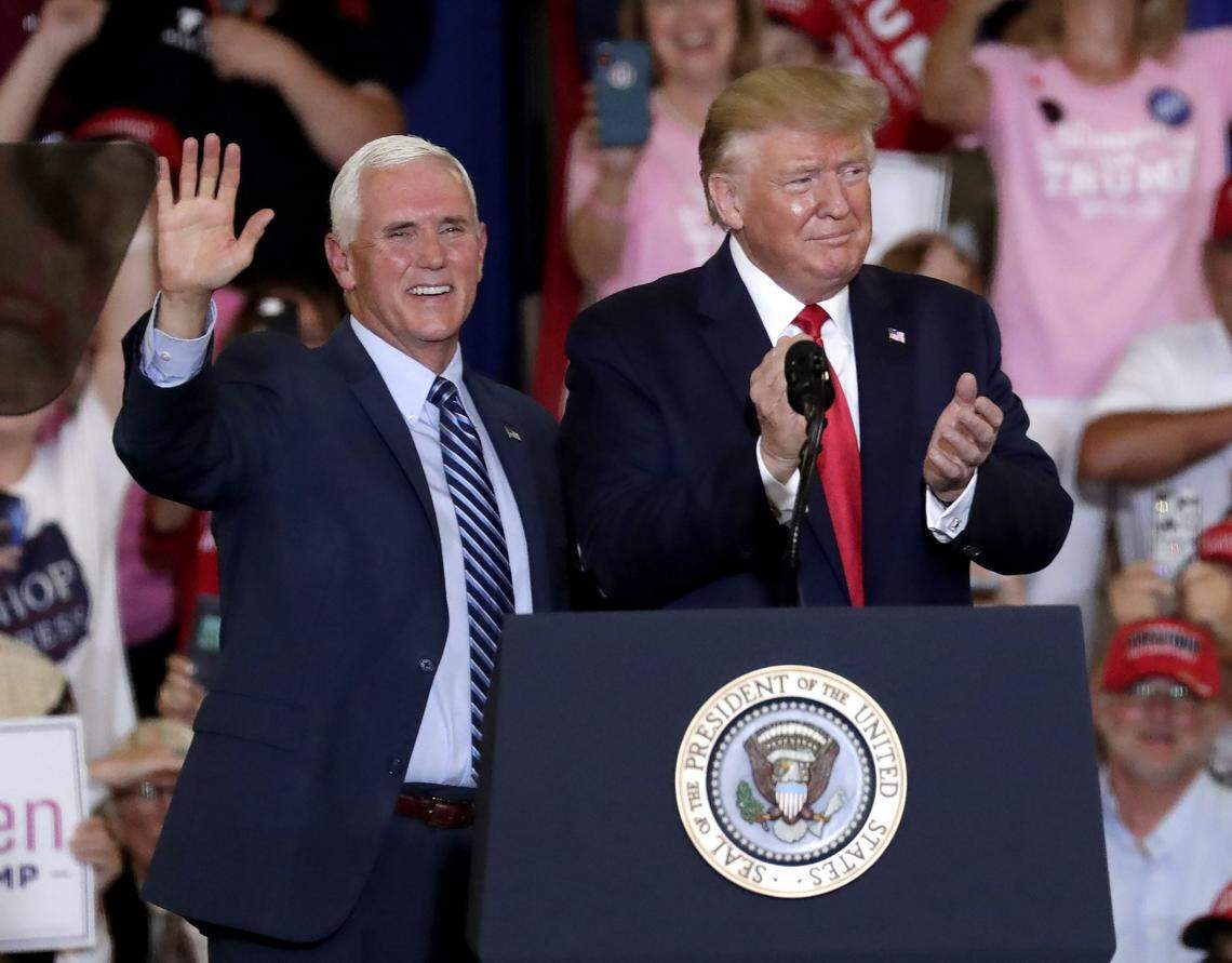 Vice President Mike Pence, left, and President Donald Trump greet the crowd at a rally in Fayetteville, N.C., Monday, Sept. 9, 2019.