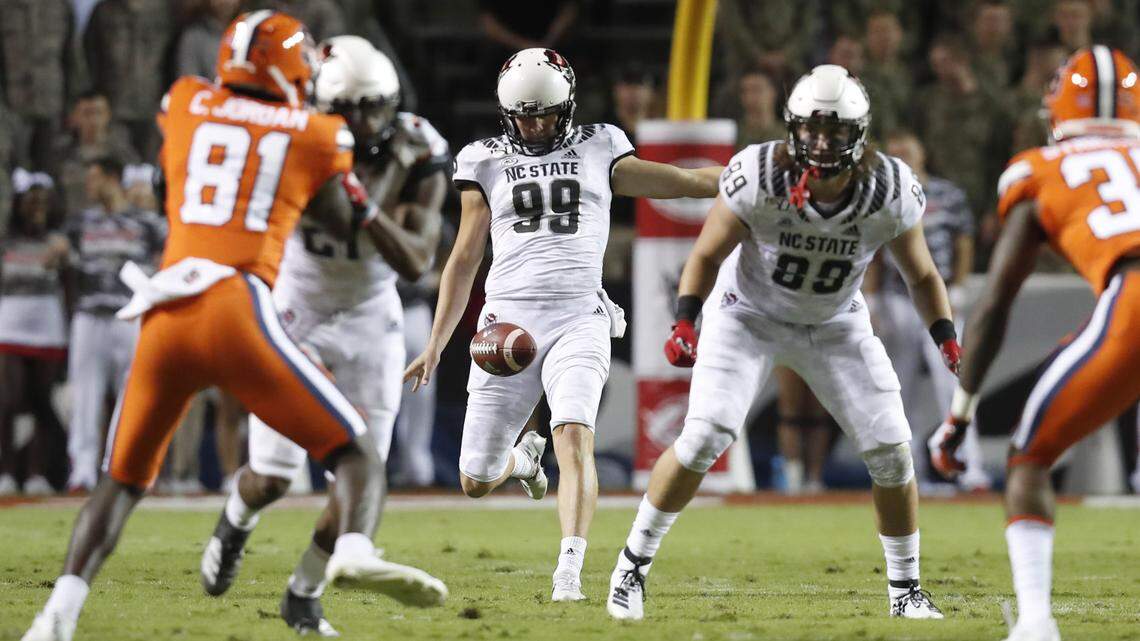 N.C. State’s Trenton Gill punts during the first half of N.C. State’s game against Syracuse at Carter-Finley Stadium in Raleigh, N.C., Thursday, Oct. 10, 2019.