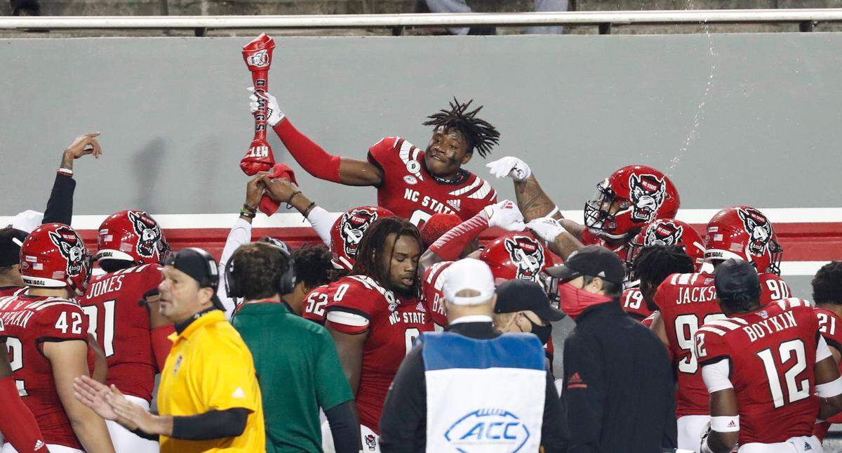 N.C. State safety Jakeen Harris (6) celebrates his interception during the first half of N.C. State’s game against Liberty at Carter-Finley Stadium in Raleigh, N.C., Saturday, Nov. 21, 2020.