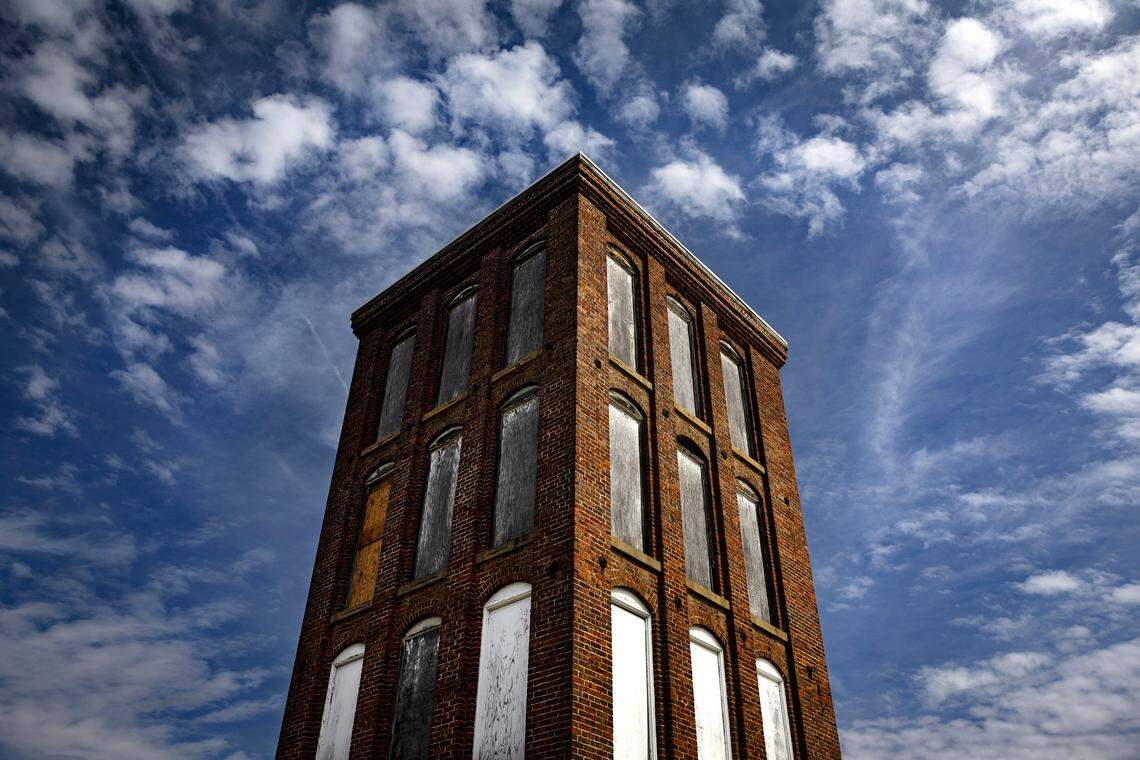 A tower stands vigil over a shuttered textile mill in Alamance County.  Mill towers often featured pulley systems for moving heavy items from floor to floor.  Small mill towns were prevalent along the Haw River.  