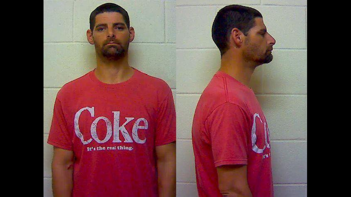Ashley Frost, 39, is charged with child abuse after police say he was using heroin outside a Waffle House while a small child was in the car.