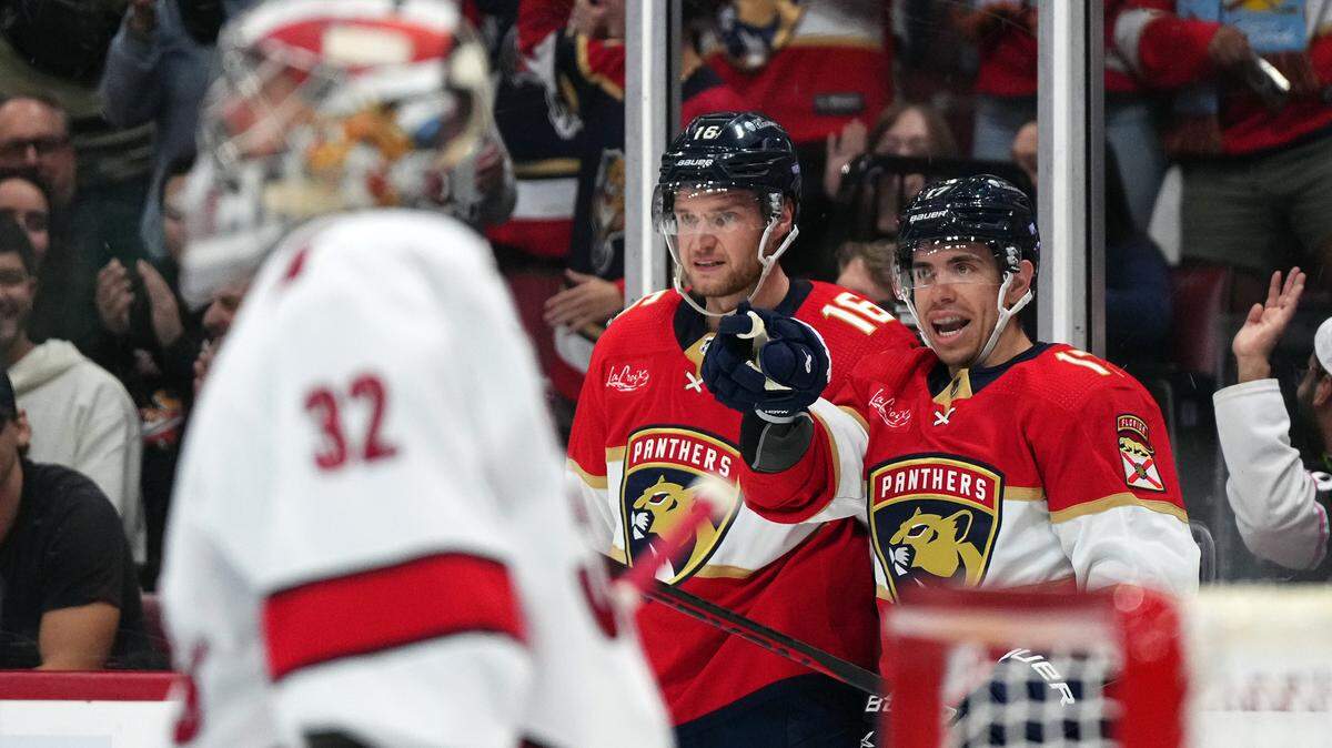 Florida Panthers center Aleksander Barkov (16) celebrates his goal against the Carolina Hurricanes with center Evan Rodrigues (17) during the second period at Amerant Bank Arena.